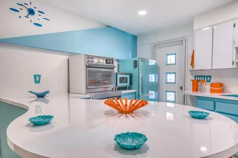 Retro turquoise kitchen details and curved island in Sarasota Round House