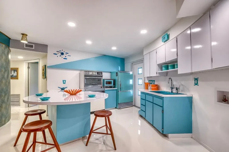 Turquoise mid-century modern kitchen staging in Sarasota Round House home