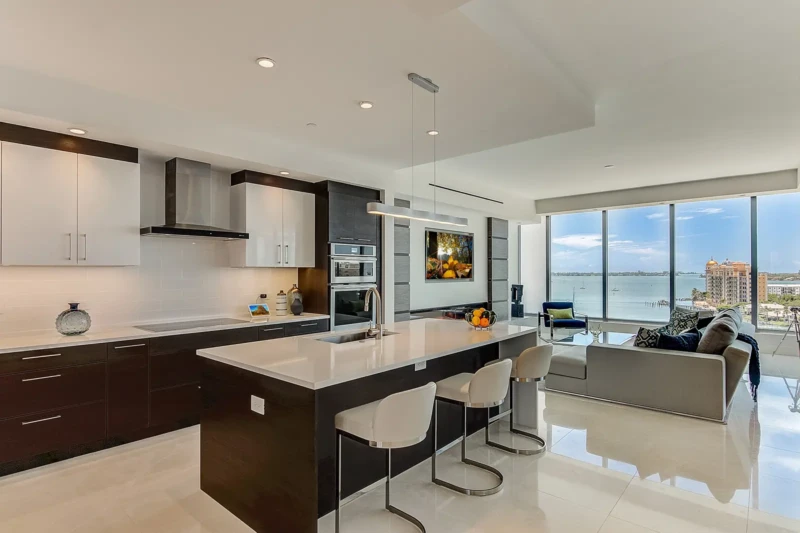 Modern luxury condo kitchen staging with bay views at The VUE Sarasota