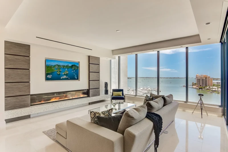 Modern bayfront living room staging at The VUE Sarasota condominium