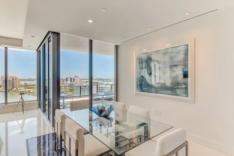 Luxury condo dining room staging with downtown Sarasota and bay views
