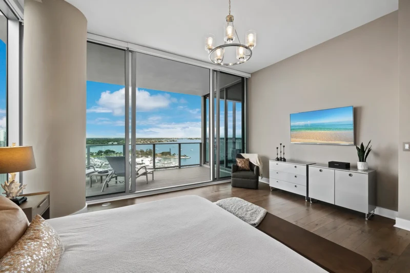 Luxury condo bedroom staging with Sarasota Bay views at The VUE