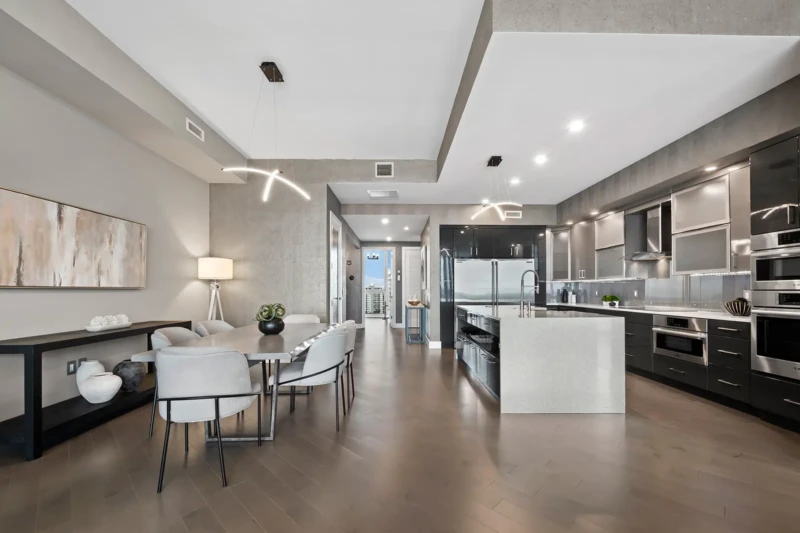 Open-concept luxury condo kitchen and dining staging at The VUE Sarasota