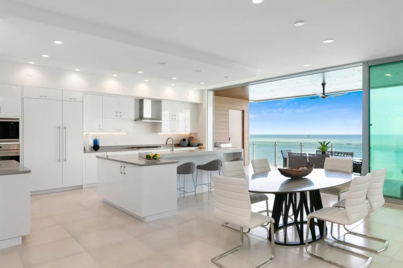 Luxury waterfront condo kitchen staging on Siesta Key featuring Gulf-front dining, open-concept design, and contemporary coastal interiors